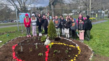 Fraser Garden 2023 Group of students stand at the newly planted garden