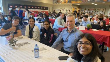 28June2023 - Superintendent Newsletter - Reimer Day 4 students and City of Abbotsford Mayor sitting at a table