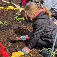 female student planting new garden
